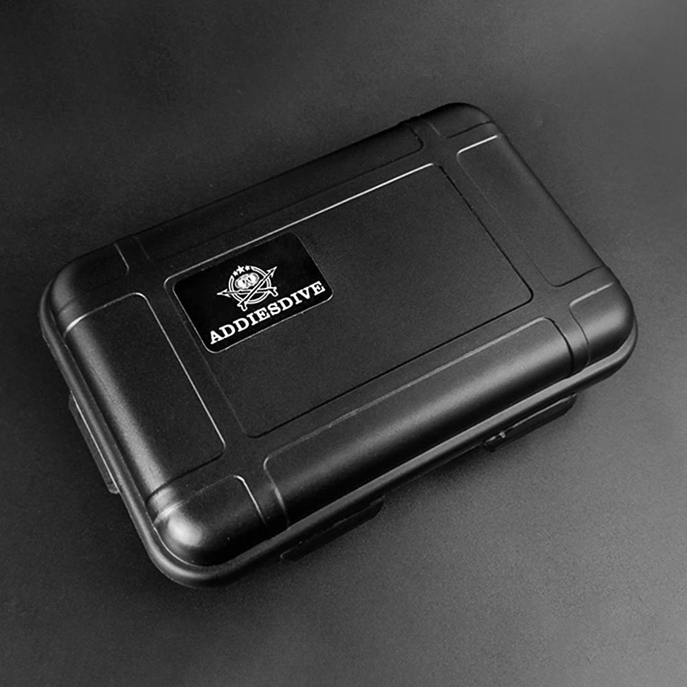NorthChrono ADDIESDIVE black rectangular case with textured surface, featuring a brand logo on the top, suitable for storing watches or equipment, set against a dark background.