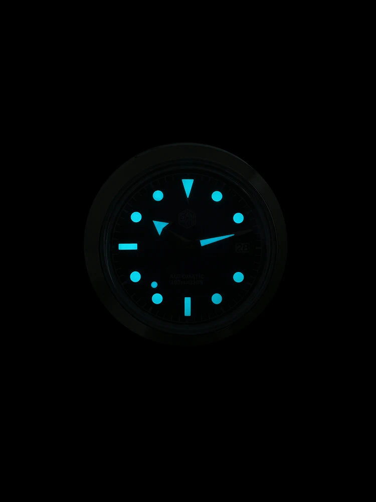 NorthChrono luminous watch face with blue glowing hour and minute hands, and hour markers, set against a dark background, designed for low-light visibility. Features a round stainless steel case and black leather strap.