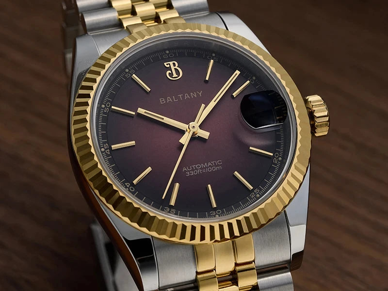 NorthChrono luxury BALTANY watch close-up, featuring a two-tone gold and silver case, round dark purple gradient dial, gold hour markers and hands, date display at 3 o'clock, and a polished crown design.