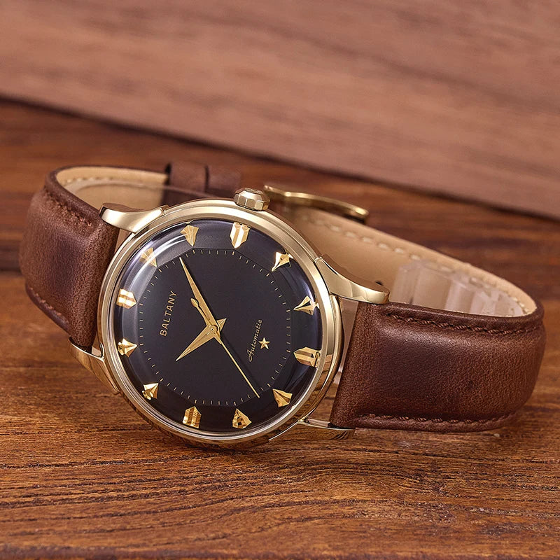 NorthChrono classic watch featuring a black dial with golden hour markers and hands, housed in a gold-toned case, complemented by a brown leather strap, presented on a rustic wooden surface.