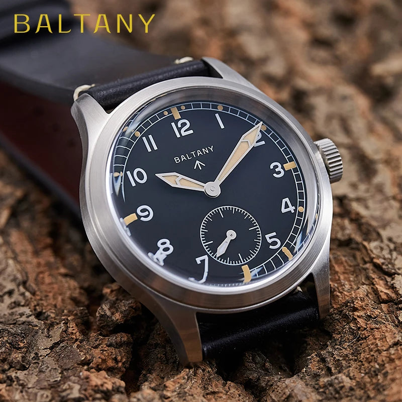 NorthChrono wristwatch featuring a black dial with white and gold hour markers, two hands, and a sub-dial, set in a stainless steel case with a leather strap, displayed on a textured wooden surface. The brand "BALTANY" is visible at the top of the dial.
