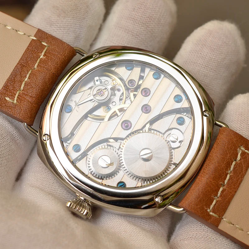 NorthChrono mechanical watch with a transparent case back showcasing intricate movement, gears, and jewels, paired with a brown leather strap, highlighting craftsmanship in watchmaking.