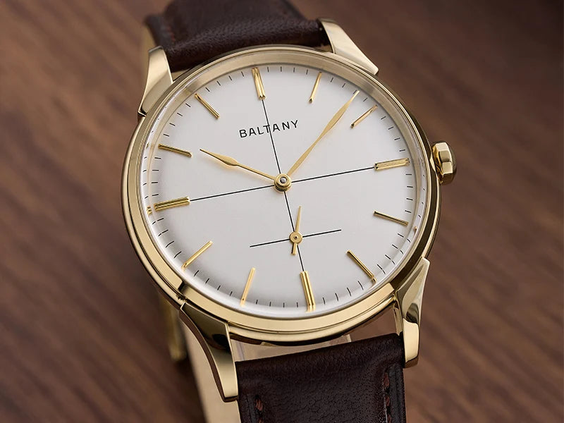 NorthChrono stylish wristwatch featuring a clean white dial with gold hour markers and hands, housed in a gold-tone case. Complemented by a brown leather strap, emphasizing minimalism and elegance.