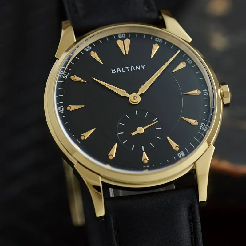 NorthChrono BALTANY watch featuring a black dial with gold hour markers and hands, a small subdial for seconds, and a black leather strap, showcasing a minimalist design that highlights its elegant features.