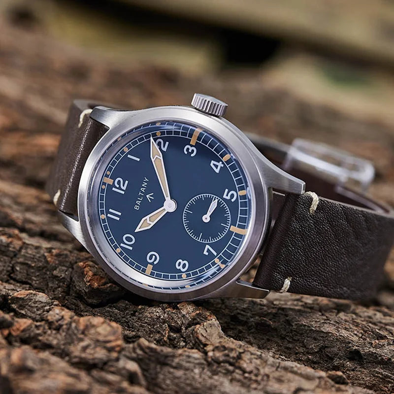 NorthChrono wristwatch featuring a dark blue dial with large white numerals, stainless steel case, and brown leather strap, displayed on a textured wooden surface, showcasing its design and craftsmanship.