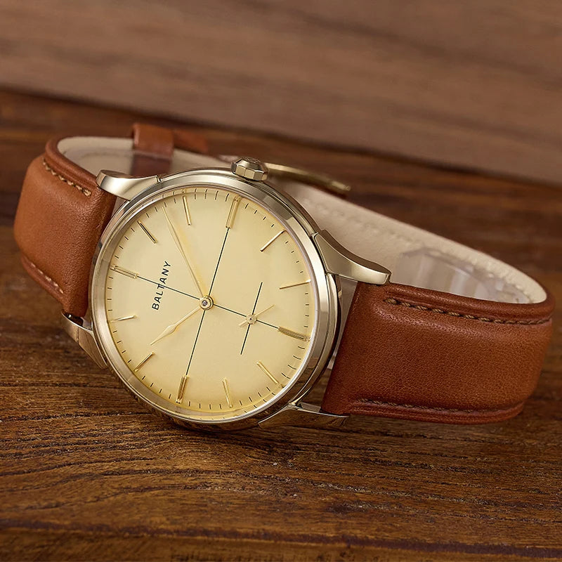 NorthChrono stylish wristwatch featuring a round gold-colored case and a yellow dial with minimalist hour markers, complemented by a brown leather strap, set against a wooden surface background.