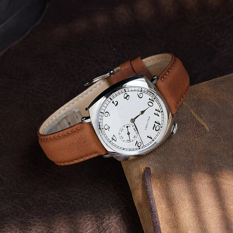 NorthChrono wristwatch featuring a white dial with large black numerals and a small sub-dial, housed in a silver case and complemented by a brown leather strap, displayed on a textured brown surface.
