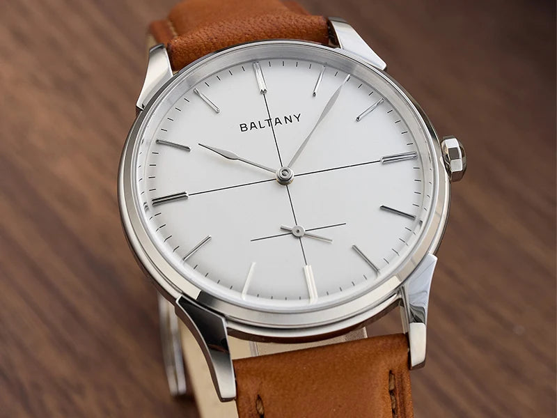 NorthChrono Baltany watch featuring a minimalist design with a white dial, silver-toned hands and markers, and a brown leather strap, showcasing an elegant aesthetic suitable for various occasions.