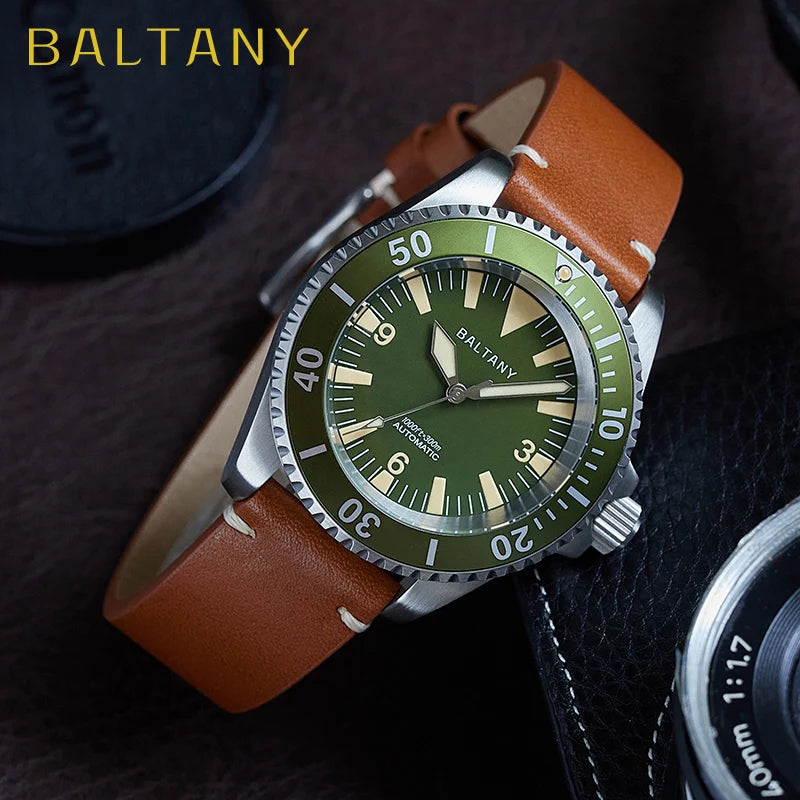 NorthChrono stainless steel watch with a green dial and brown leather strap, featuring hour and minute markers, a rotating bezel marked with numbers, and the brand name "BALTANY" displayed prominently against a textured background.