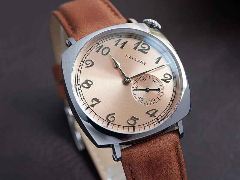 NorthChrono square-shaped watch featuring a rose-gold textured dial with bold black Arabic numerals and a sub-dial for seconds. The watch is mounted on a brown leather strap and displays the brand name "BALTANY.