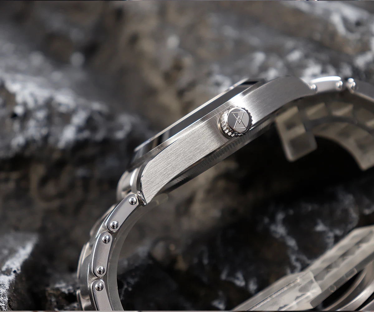 NorthChrono close-up of a stainless steel watch featuring a metallic finish and a crown for time adjustment, showcasing its sleek design and bracelet against a textured, natural-looking background.